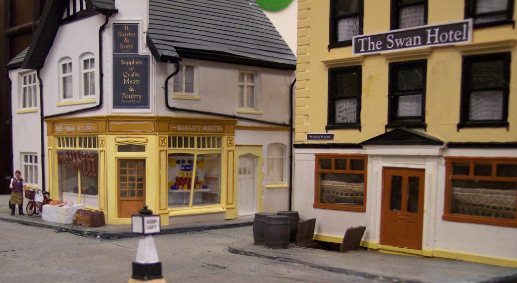 Station Square, the Ash Valley townscape, showing the Butcher's and the Swan Hotel Public House.