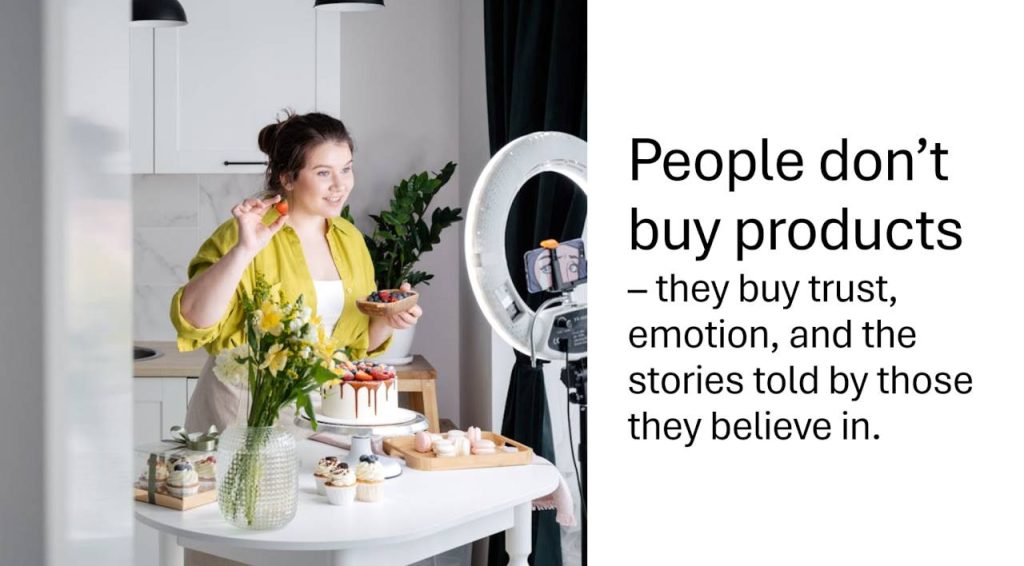 A young woman filming a video in her kitchen, presenting a decorated cake and smiling warmly at the camera, illustrating authentic influencer marketing through personal connection.