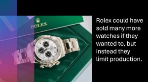 A luxury Rolex watch with a white dial and black subdials displayed on a green leather box, with branded packaging in the background. The image highlights exclusivity and premium branding.