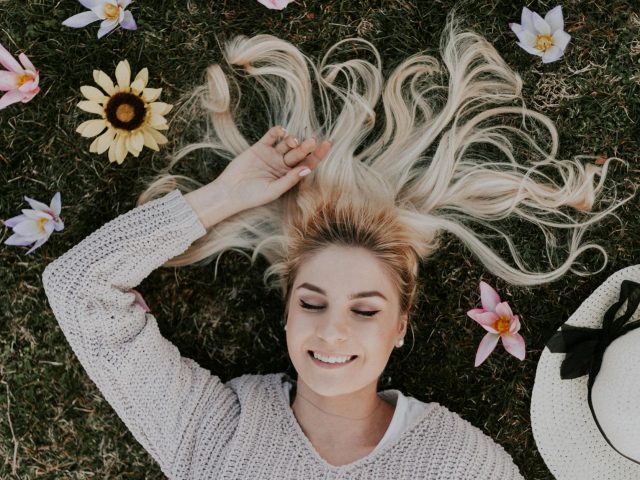 woman lying on flowers