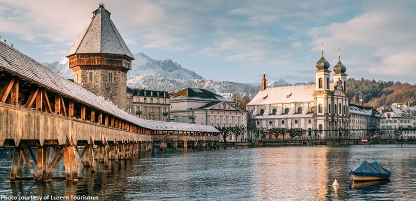 The Kapellbrücke or Chapel Bridge connects Lucerne’s Old Town (Altstadt) with the right bank of the Reuss River