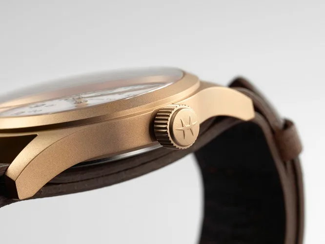 Close-up of Hamilton's Khaki Field Mechanical in bronze, showcasing the robust crown and durable case, ideal for outdoor wear.
