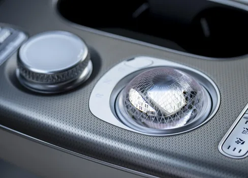 The Genesis GV60 Sport Plus features a central console featuring a stylish crystal ball that hides the gear selector.
