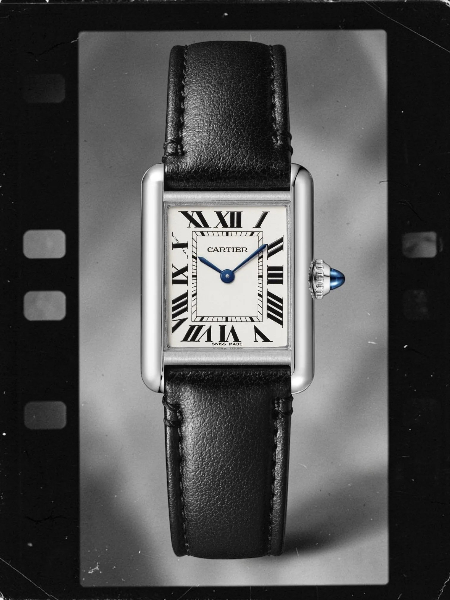 Cartier Tank Must watch small model in steel with black strap, similar to Rudolph Valentino's.
