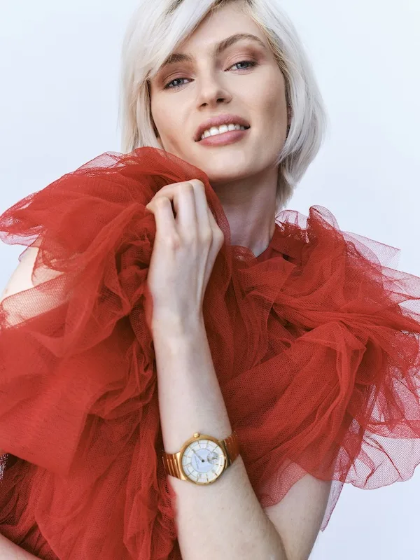 LOUIS VUITTON 40mm Tambour automatic in 18kt yellow gold. HECTOR MACLEAN Fire of the Battle red tulle dress. © Ian Harrison for I-M Inquisitive Minds