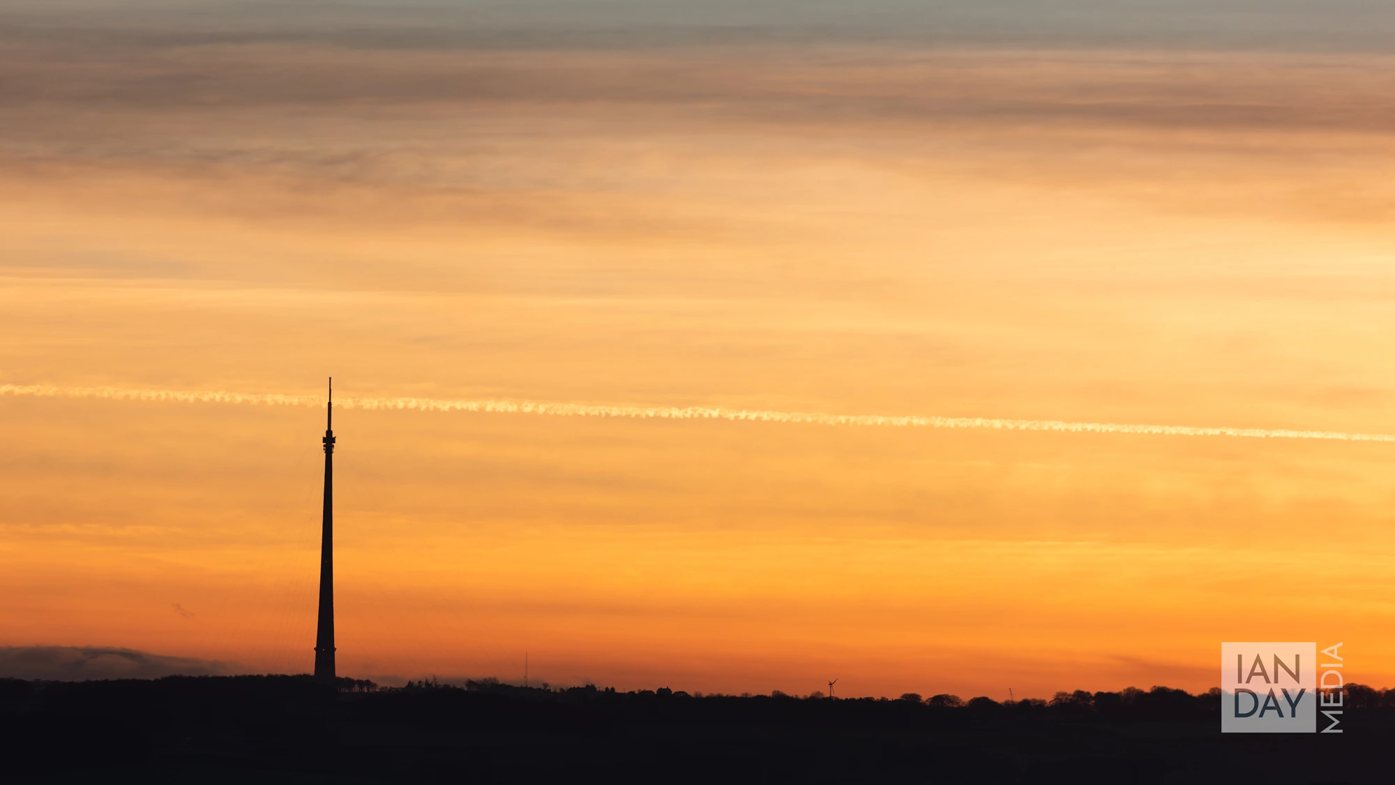The sun sets behind the Emley Moor television tower in West Yorkshire. The tower is the tallest freestanding structure in the United Kingdom.