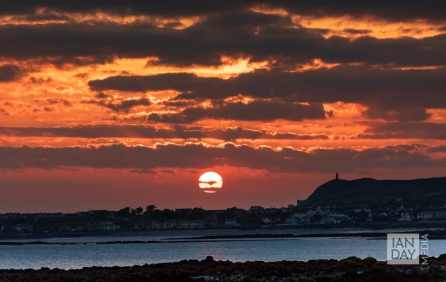 The sun sets over Port St Mary on the Isle of Man.