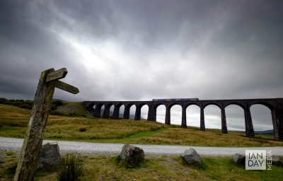 A commuter train travels across the world-famous Ribblehead Viaduct in North Yorkshire.