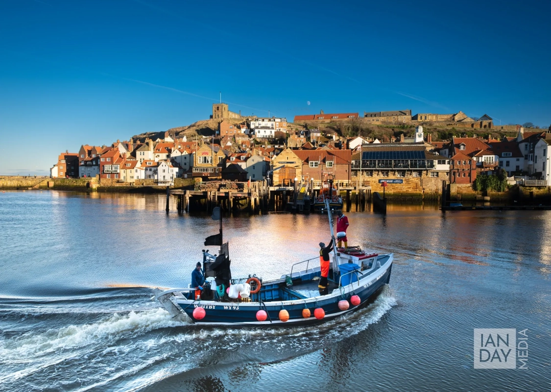 Ian Day Media - Photography, Editing & Training. A fishing boat returns to the historic port of Whitby, North Yorkshire.