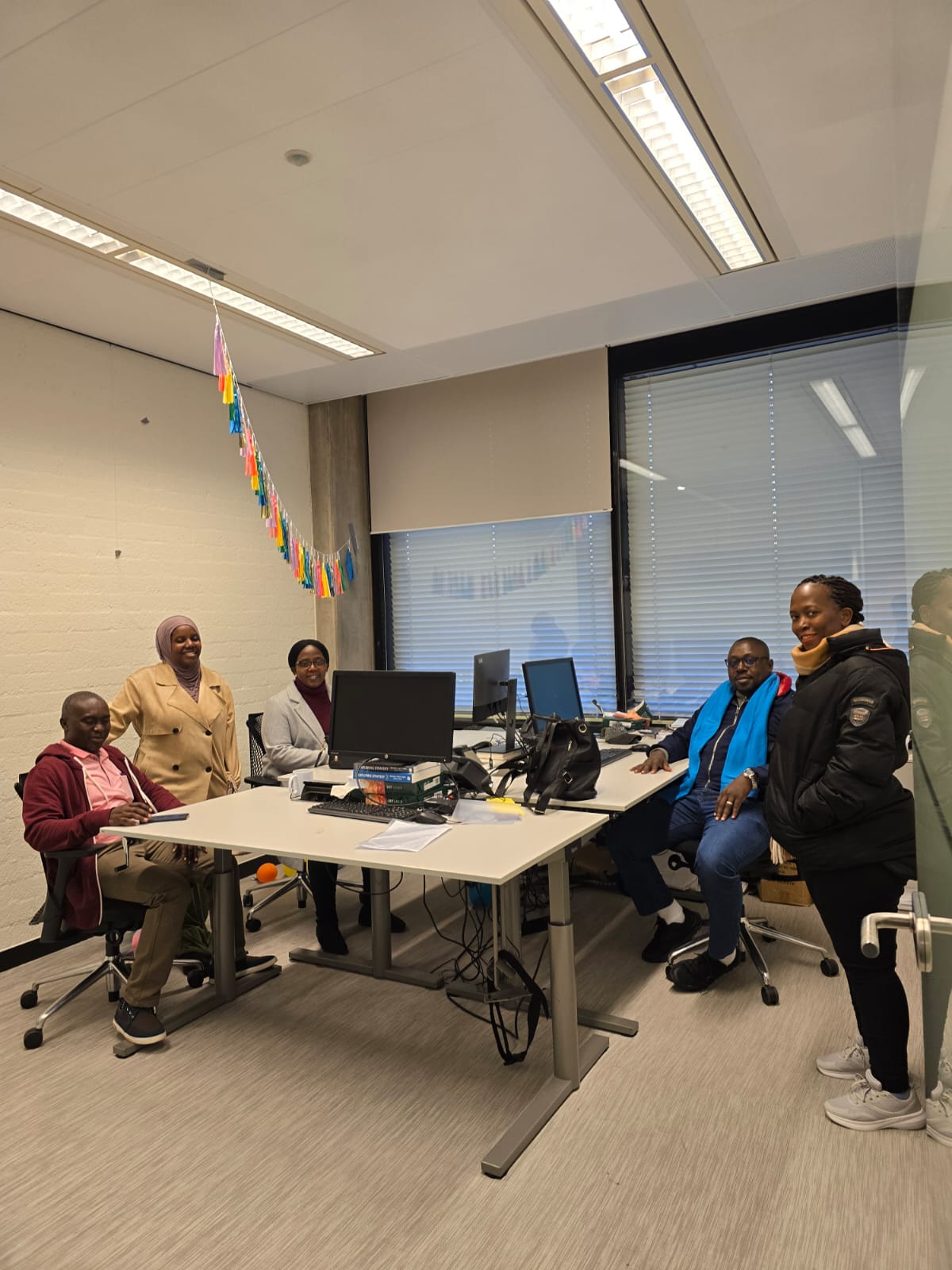 ICT-4MRPQ project team members share a light moment at the School of Business and Economics