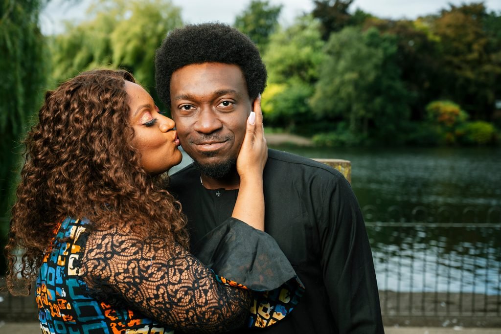 Couple sharing an intimate moment outdoors.