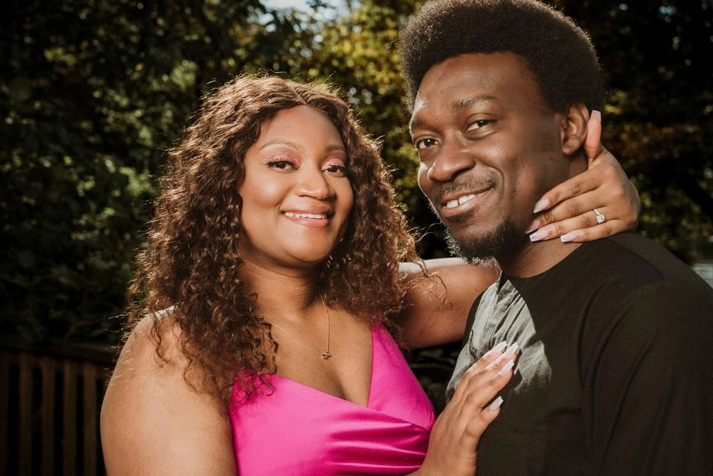 Couple posing in golden hour light.