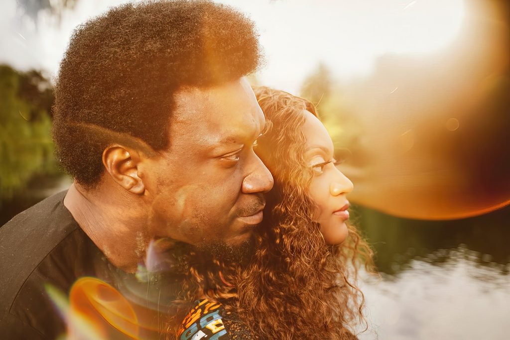 Couple embracing during golden hour.