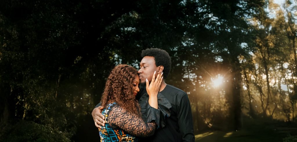 Couple embracing in golden hour light.