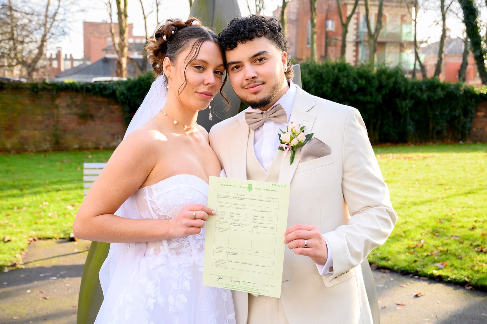 Bride and groom walking hand in hand at Sandwell Register Office West Bromwich - Ikonic Media