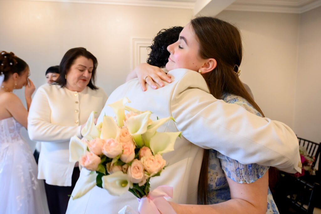 Bride and groom embracing after wedding ceremony in West Bromwich.
