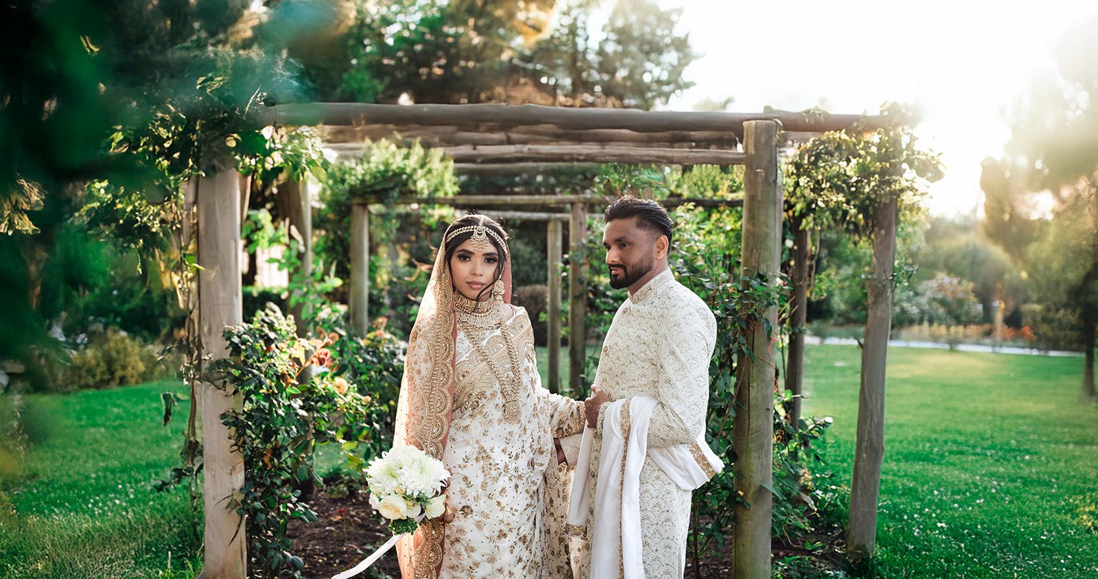 Asian engagement shoot Birmingham — bride in red lehenga, cinematic outdoor portrait