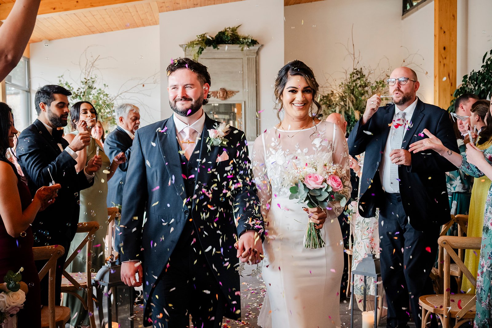 Bride and groom exchanging vows at Highfields House Sandwell Registry Office West Bromwich