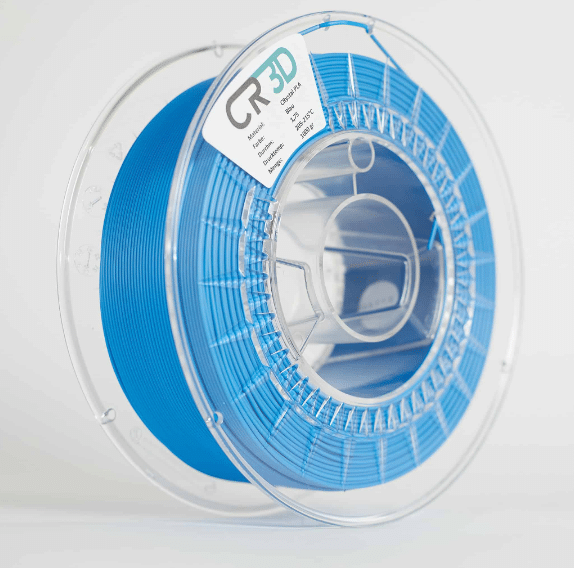 Seitliche Ansicht einer Spule mit blauem Filament, in einer transparenten Kunststoffverpackung.