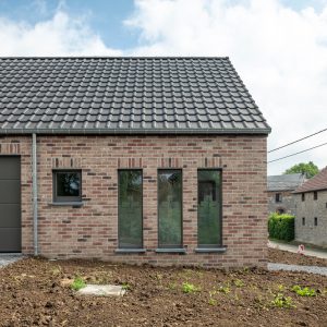 Façade arrière d'une maison contemporaine à Heron - Cabinet Kinésithérapie