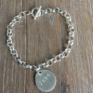 Pewter hand-stamped charm on bracelet