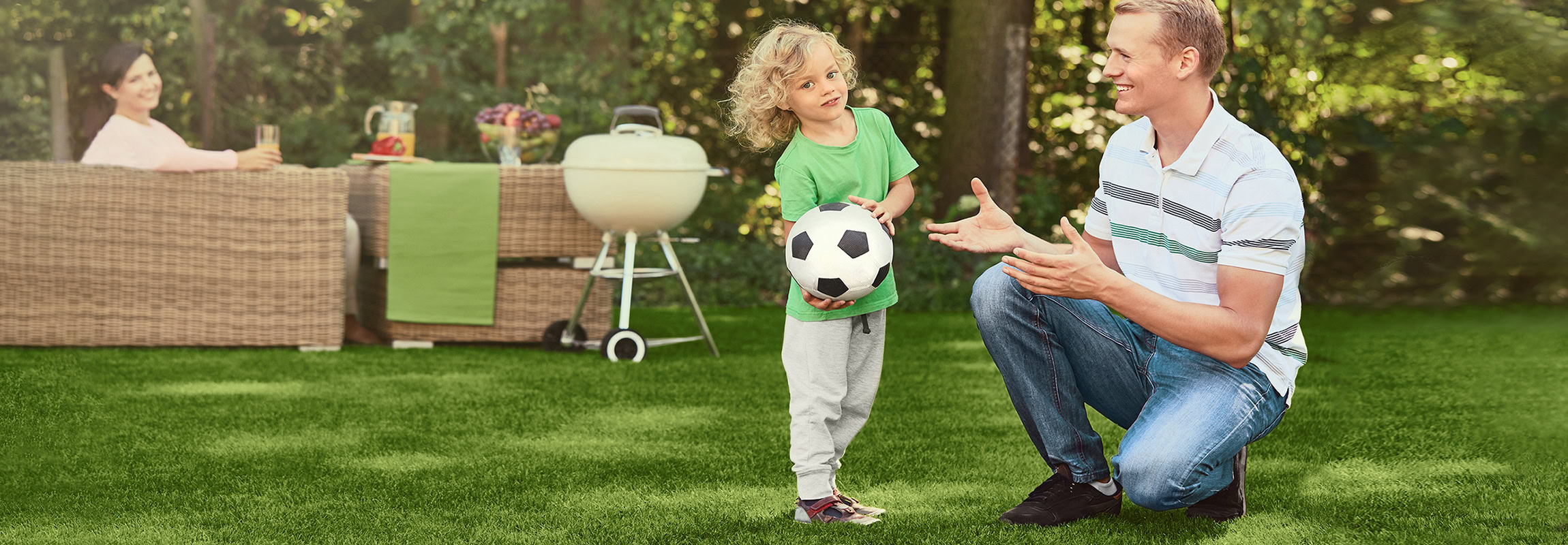 Little,Boy,Having,Fun,Playing,Football,With,His,Father
