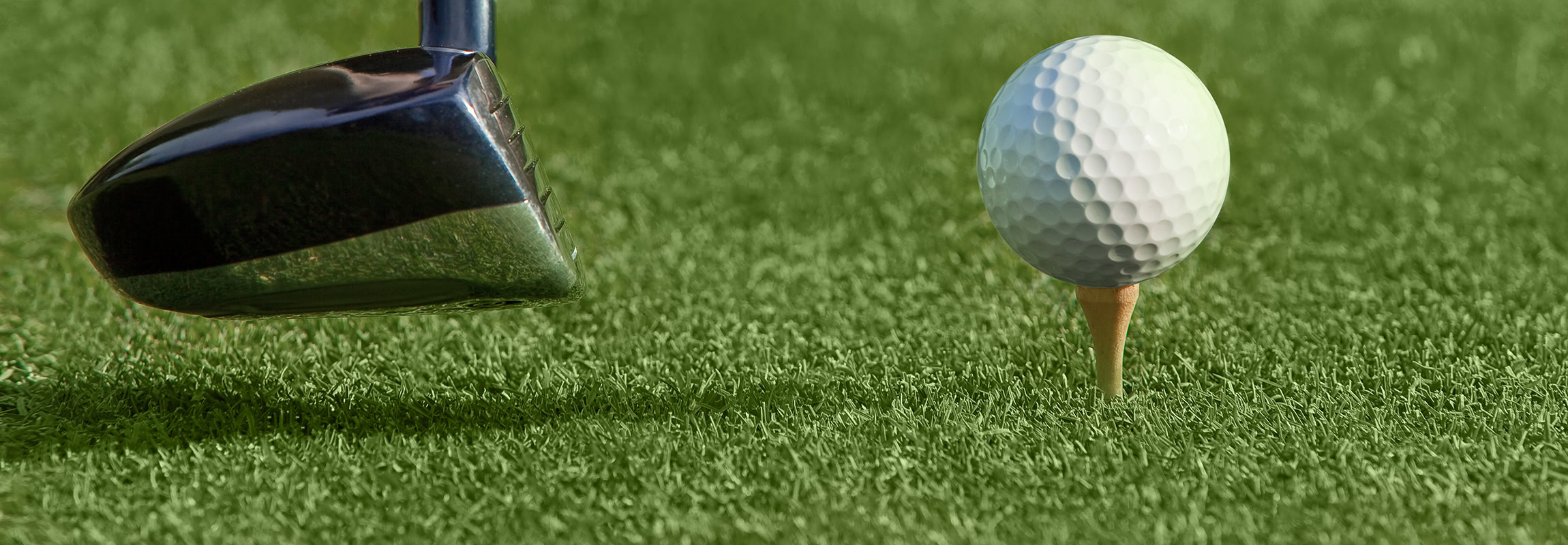 Close,Up,Of,Golf,Ball,On,A,Tee,With,The