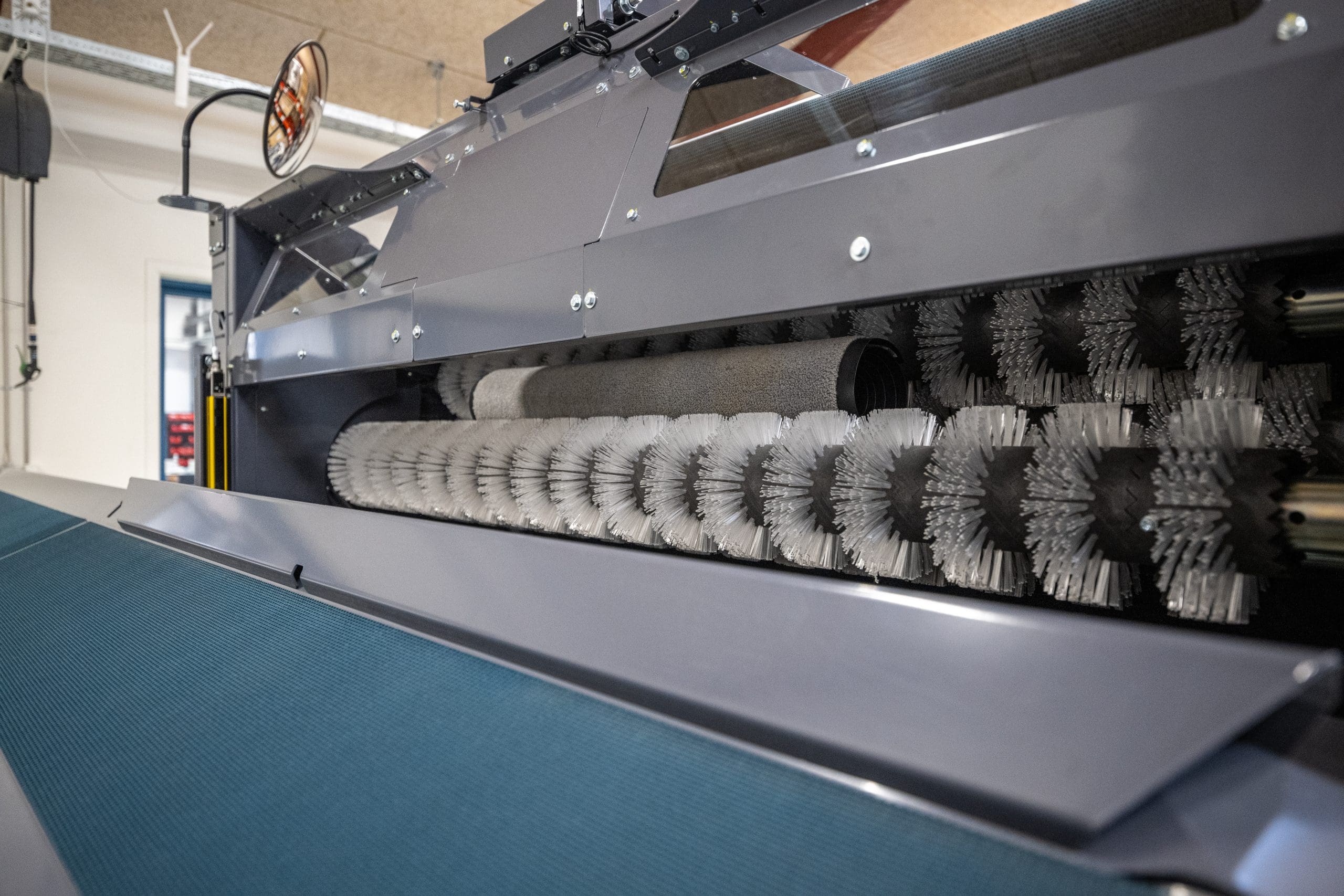 Close-up showing the Inwatec Typhoon Mat Roller machine.