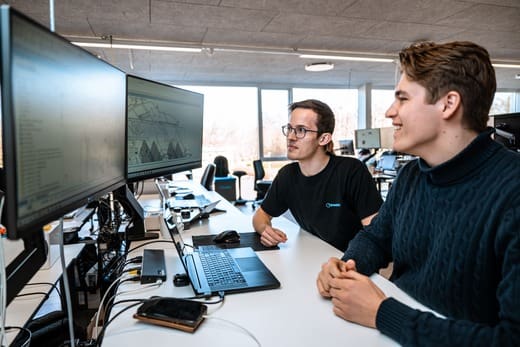 Mads and Anton from Inwatec working on two computer screens. You can see they are working with 3D drawings.