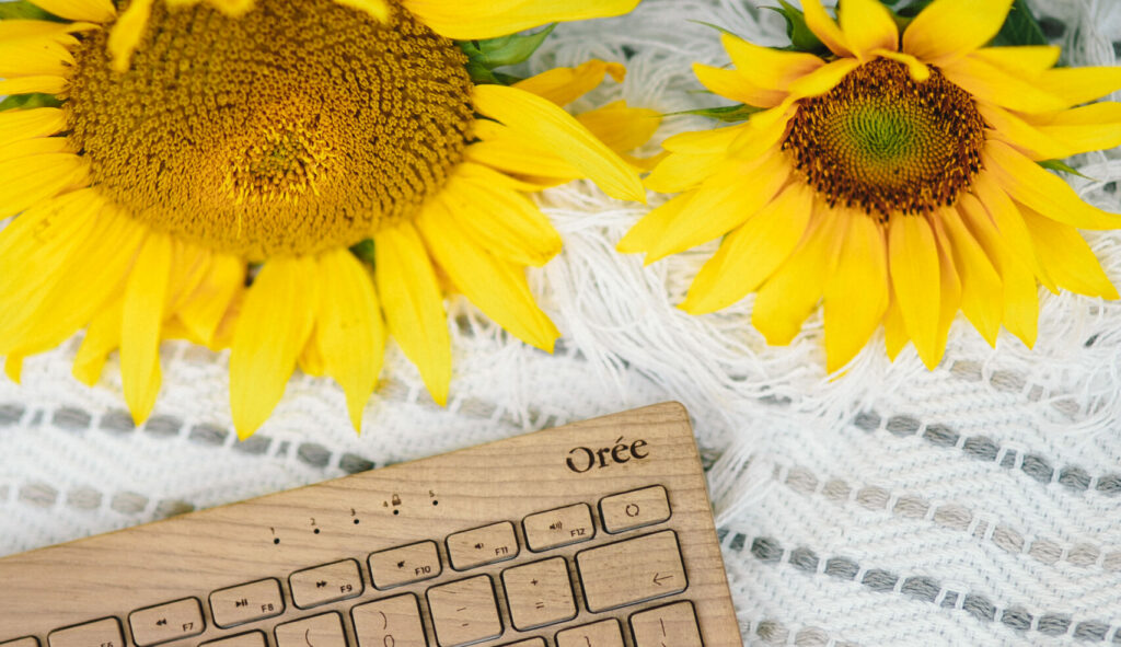 wooden keyboard with sunflowers