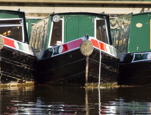 three similar boats next to one another