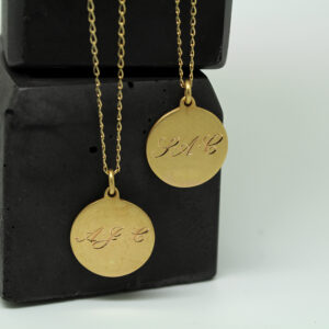 gold medal with engraved initials by Julie Nicaisse Jewellery designer in London