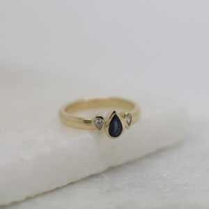 Blue sapphire and diamond engagement ring