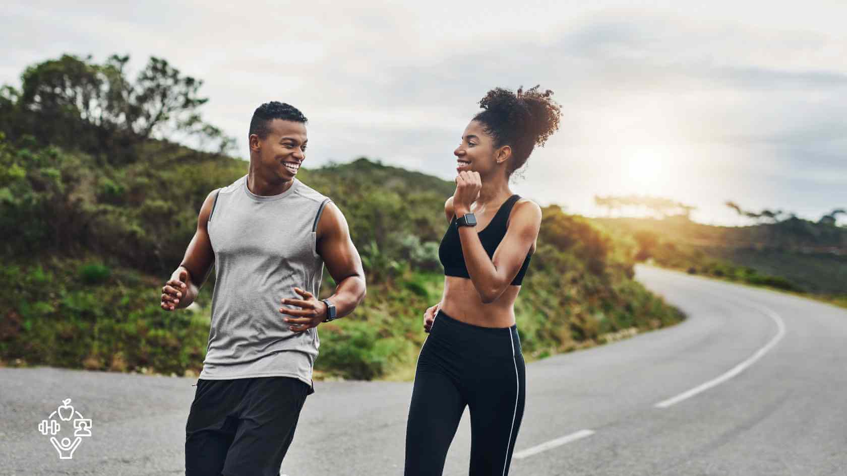 a man and woman running on a road