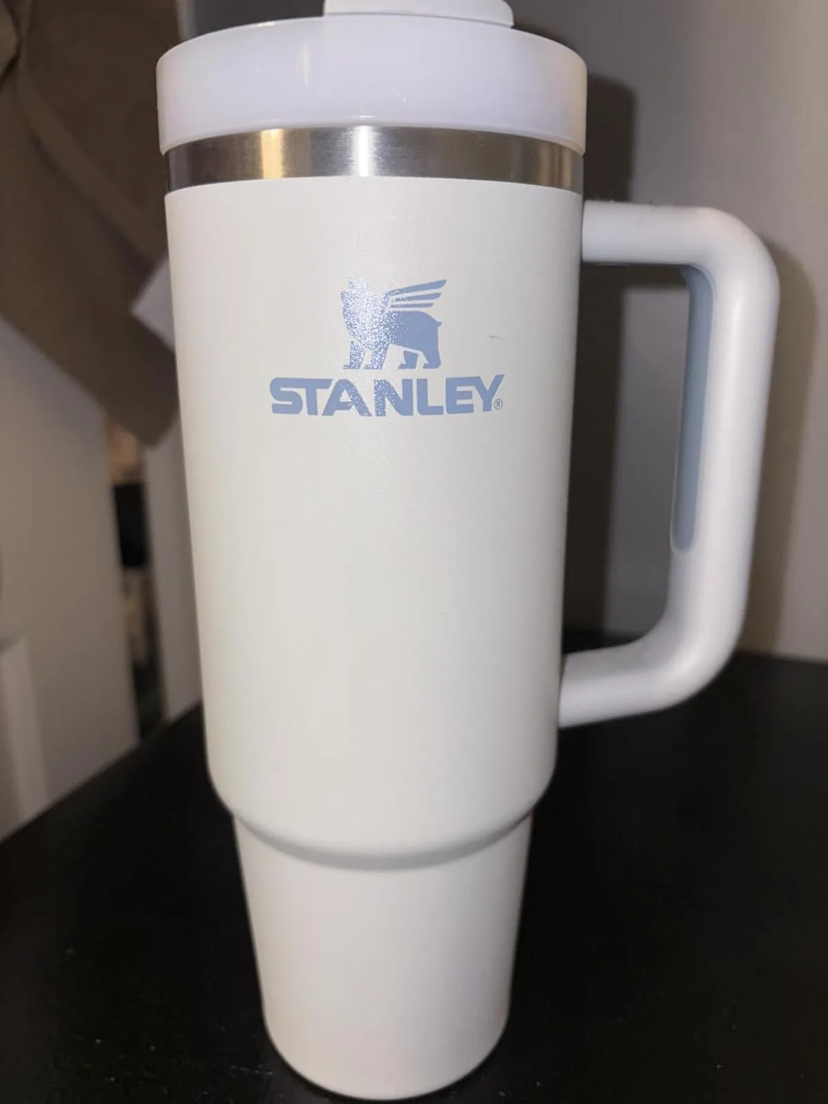 a white and silver coffee mug