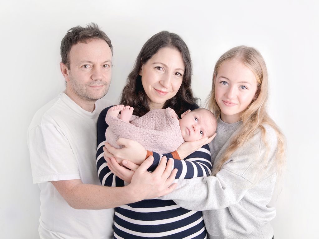 older sibling and newborn with family posing newborn photographer edinburgh