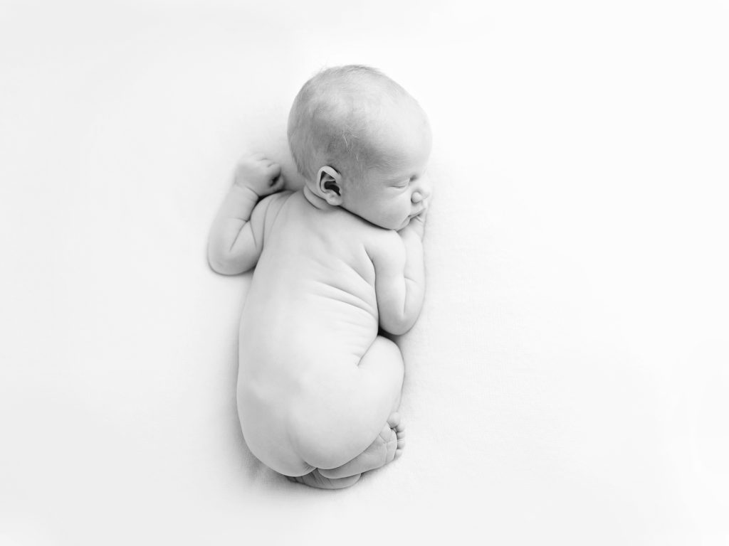 naked baby on tummy posing white studio newborn photography edinburgh