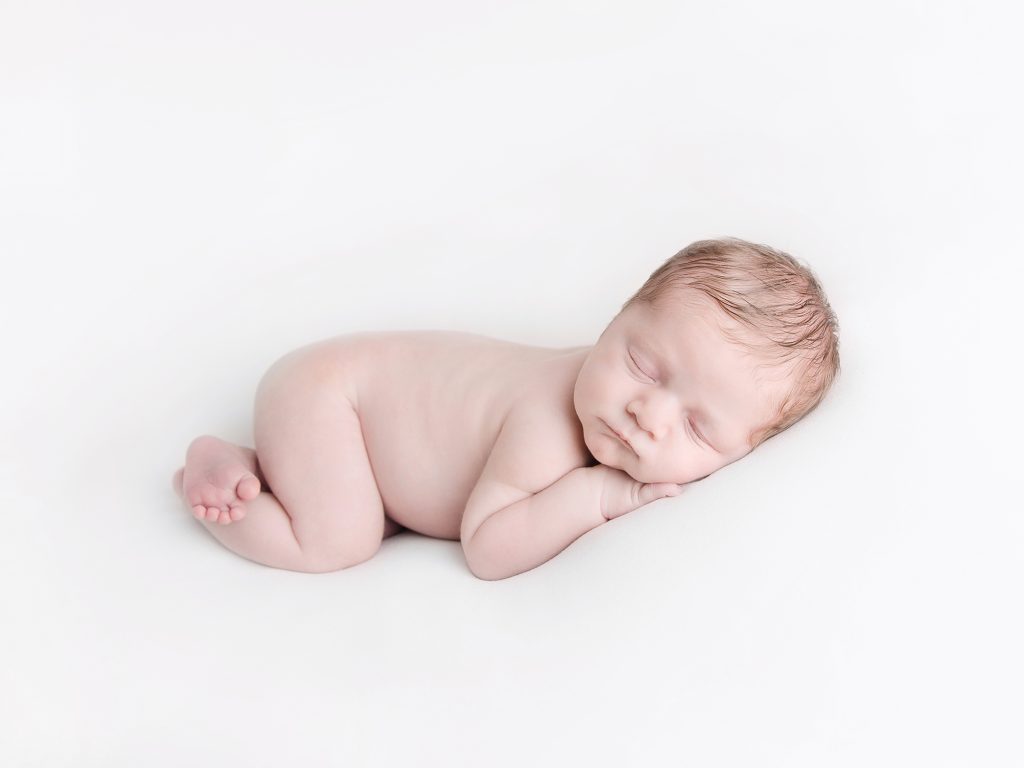 naked newborn on white background newborn photographer edinburgh