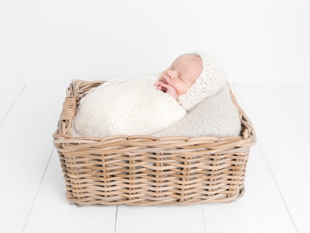 baby in a basket with a hat newborn photography edinburgh posing ideas