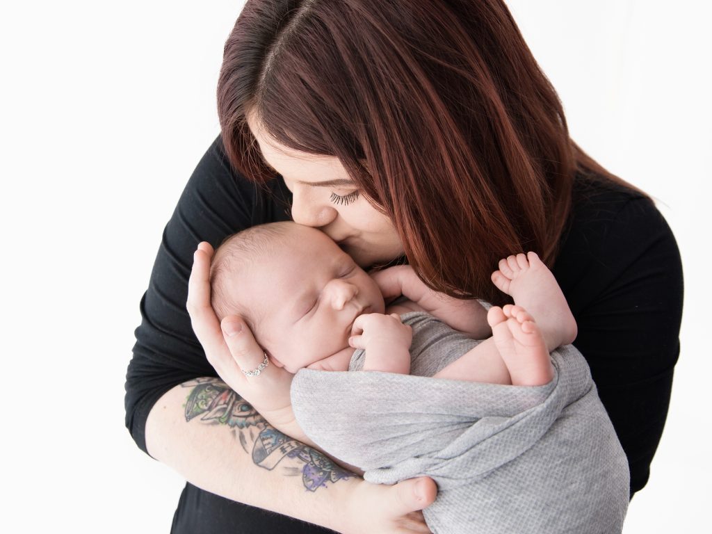 mum kissing baby newborn photography edinburgh