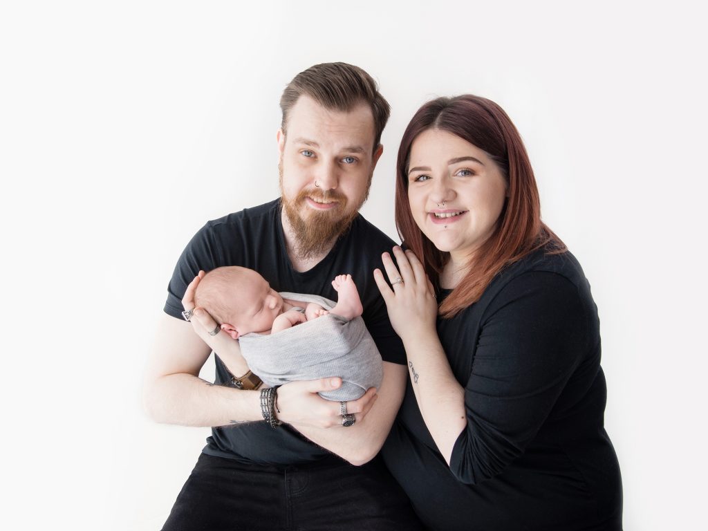 baby with mum and dad posing studio  newborn photoshoot edinburgh