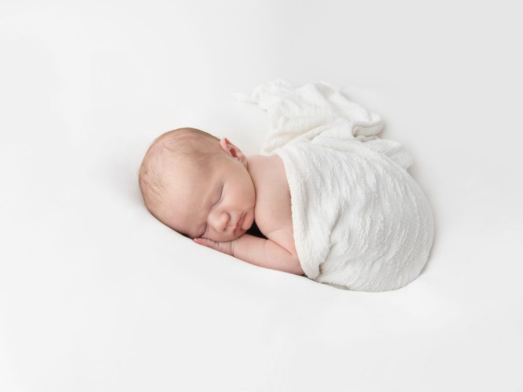 newborn posing wrapped on tummy newborn photography edinburgh