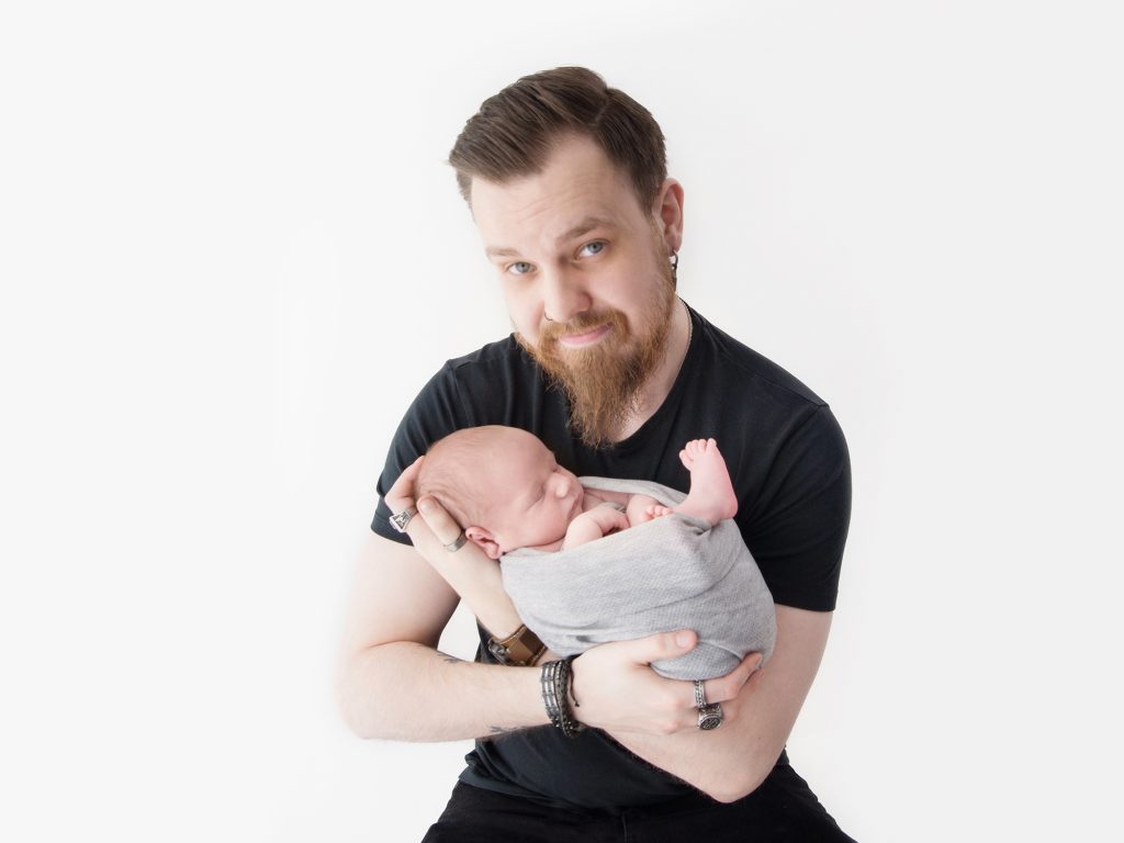 dad with newborn posing