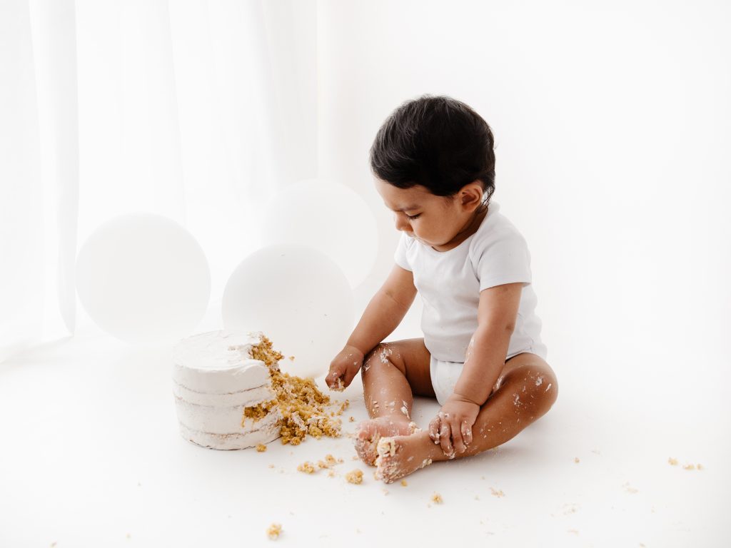 cake smash photoshoot in all white studio backlit ideas