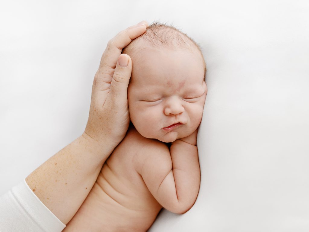 newborn with parents hands photos edinburgh