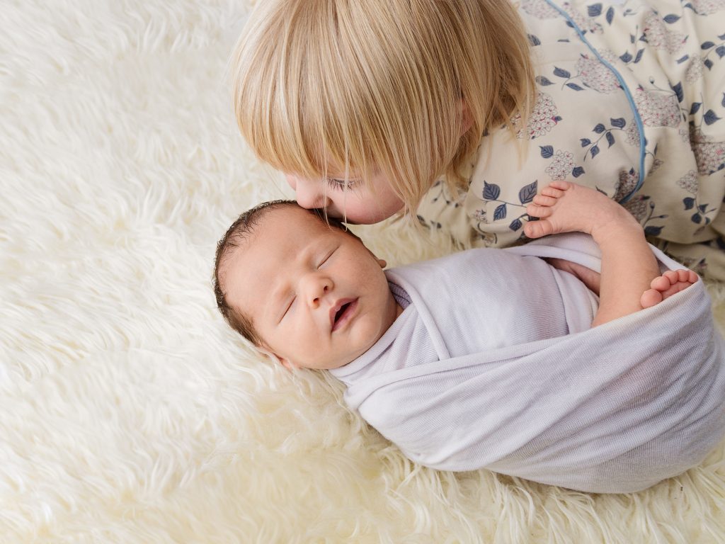 newborn and sibling photo posing