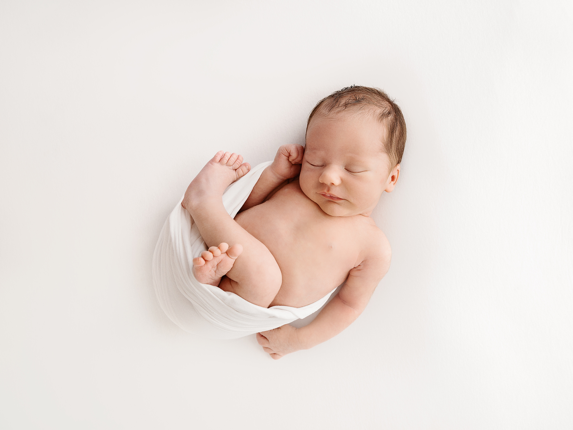 all white newborn photos posing