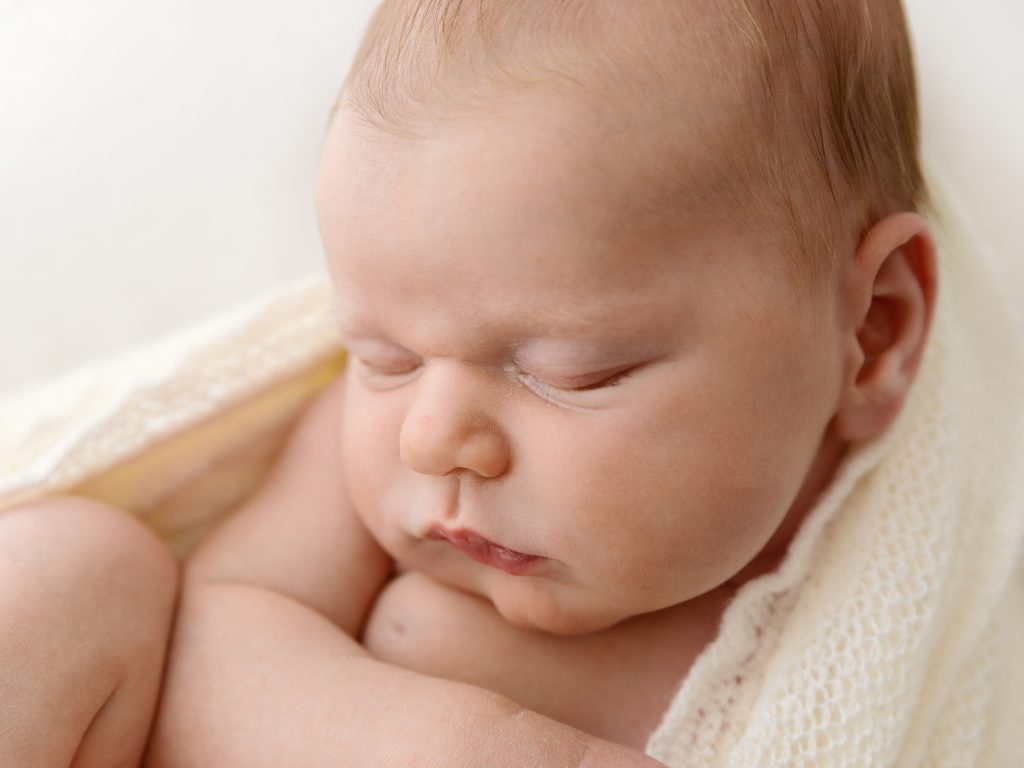 close up newborn photography posing