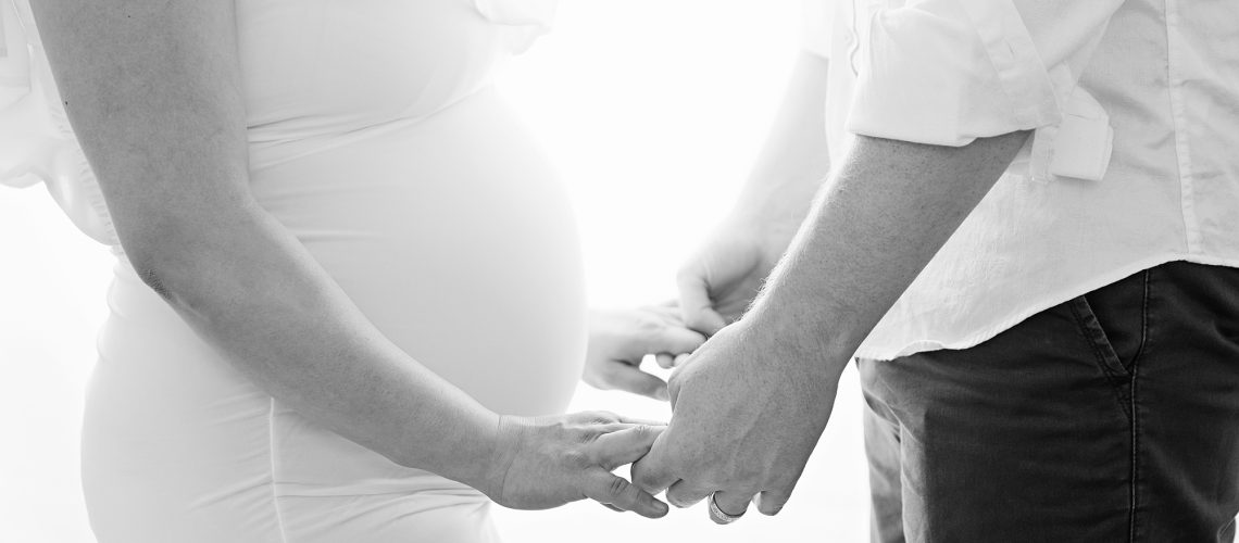 pregnant couple holding hands maternity photoshoot edinburgh