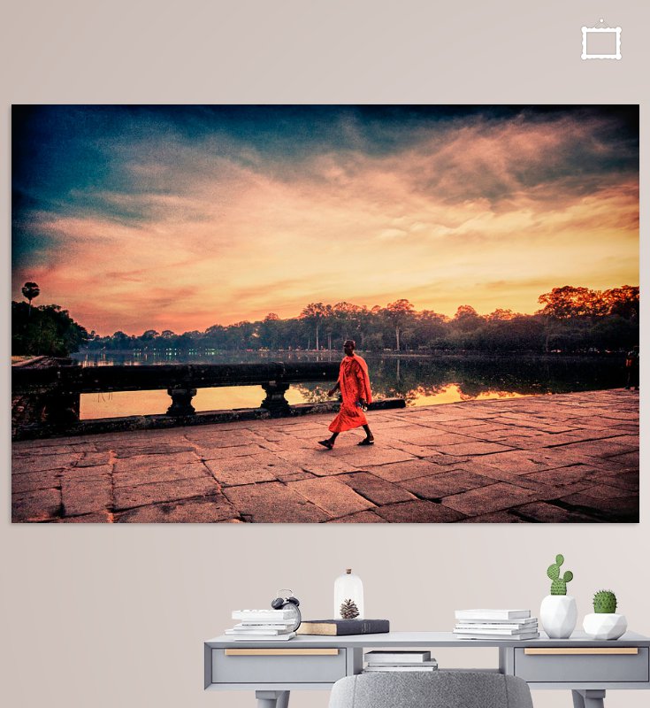 Angkor Wat monk walking during sunset photography